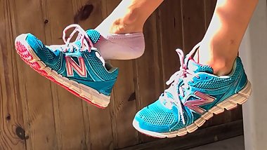 Cute sexy feet take off sneakers and show soles