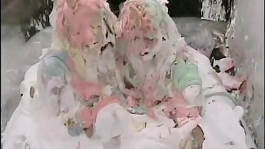 Two lesbians covered in pies and foam
