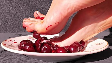 Making fresh cherry juice with my feet.