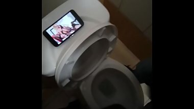 Two sexy boys jerking off to lesbian porn