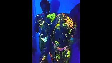 Lesbians washing paint off in shower