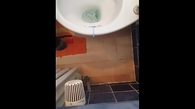 Alex Pissing on toilet