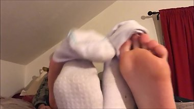 two lesbians show off their socks and barefeet