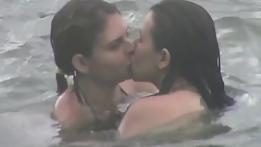 LESBIANS intimate on the beach