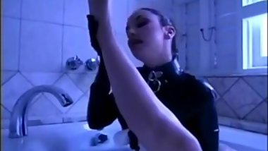 Lesbian maid licks her Mistress's feet in bathtub